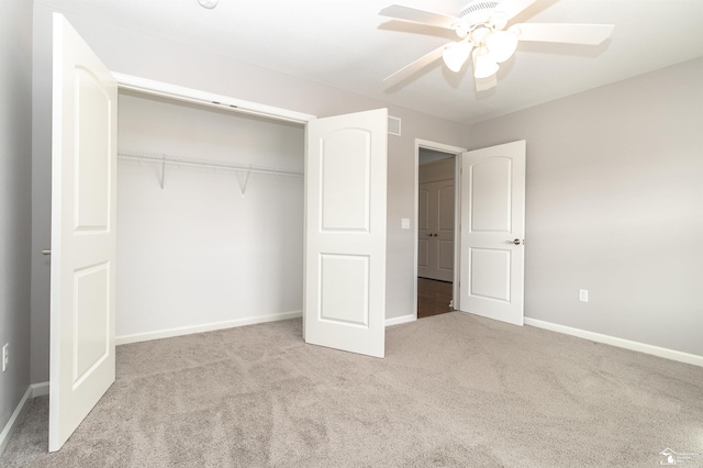 unfurnished bedroom featuring a closet, carpet flooring, a ceiling fan, and baseboards