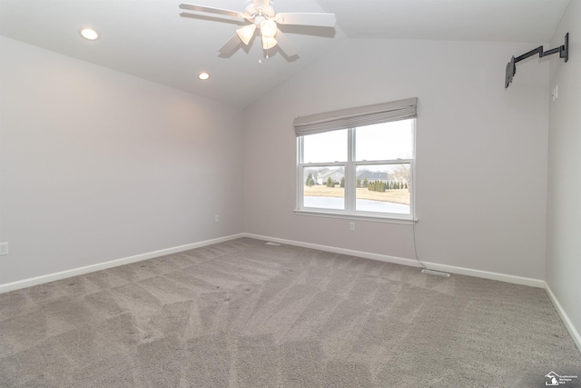 carpeted empty room with visible vents, baseboards, ceiling fan, vaulted ceiling, and recessed lighting