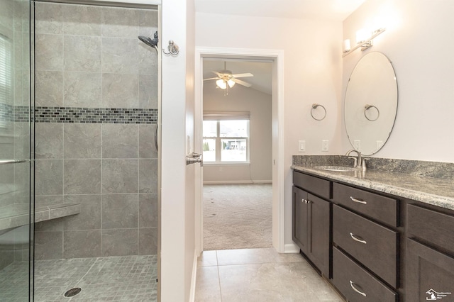 full bath with lofted ceiling, a stall shower, ceiling fan, and vanity