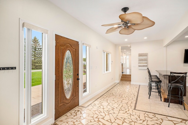 foyer entrance with a ceiling fan, recessed lighting, baseboards, and light tile patterned floors