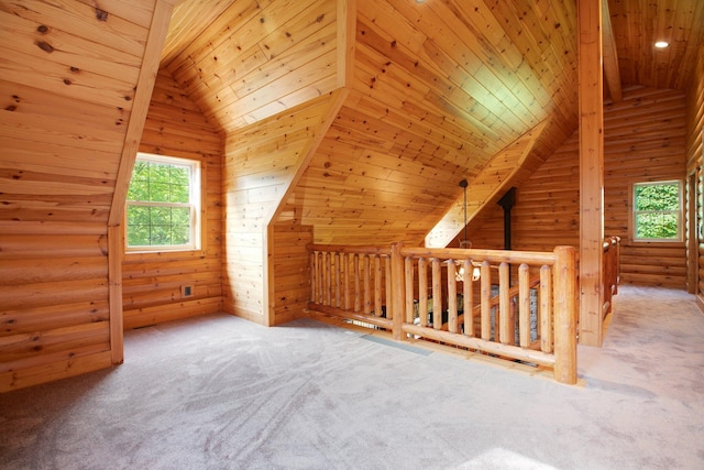 additional living space with lofted ceiling, rustic walls, carpet flooring, wood walls, and wooden ceiling