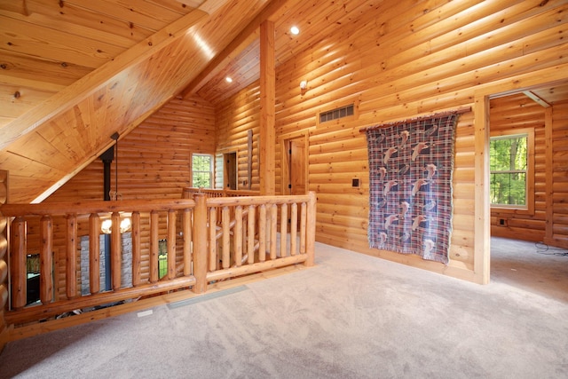 unfurnished living room featuring high vaulted ceiling, wooden ceiling, carpet flooring, beam ceiling, and rustic walls