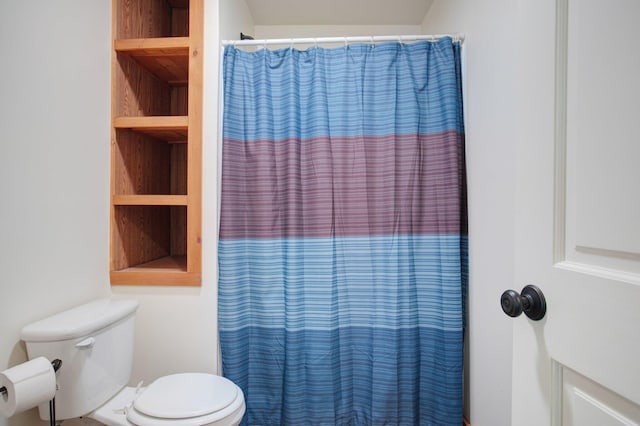 full bathroom featuring built in features and toilet