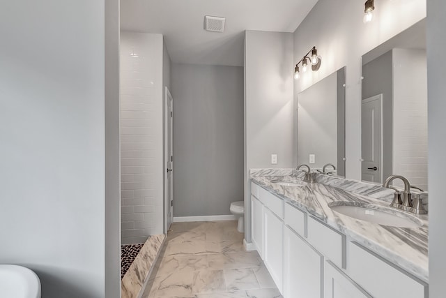 bathroom with marble finish floor, visible vents, a sink, and toilet