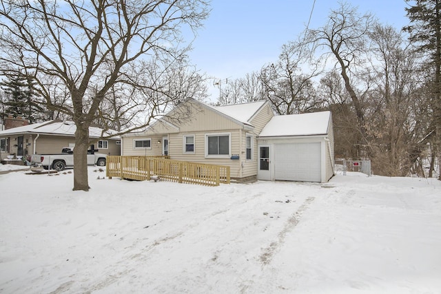 view of front of property featuring a garage and a deck