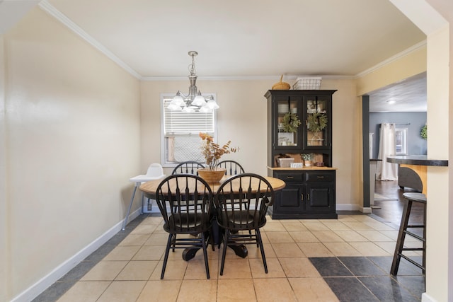 dining space featuring light tile patterned floors, a notable chandelier, baseboards, and crown molding