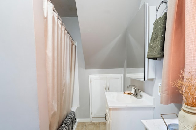 full bath featuring tile patterned floors, baseboards, shower / bath combination with curtain, and vanity