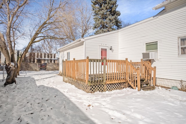 snow covered deck featuring cooling unit