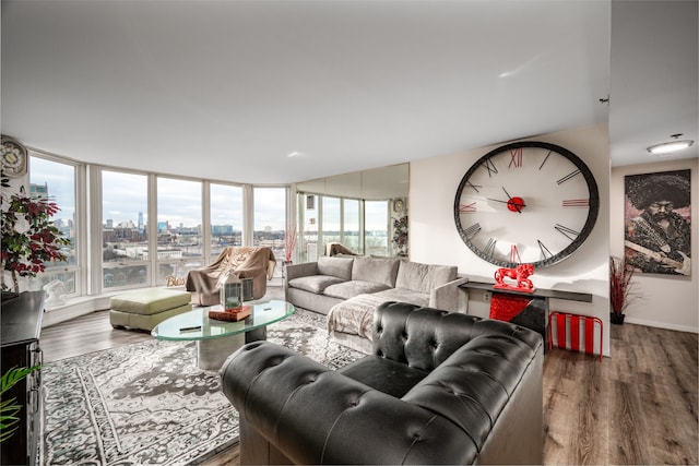 living room with a city view and wood finished floors