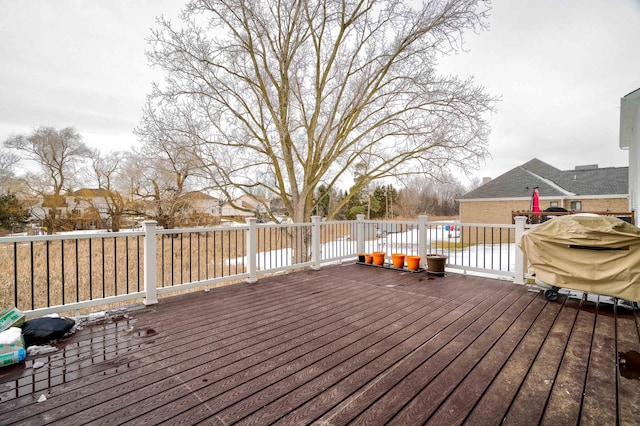 wooden deck with grilling area