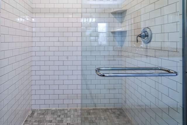 full bath featuring a shower stall