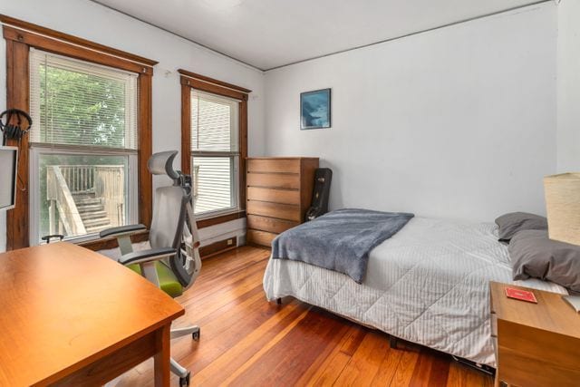 bedroom with wood finished floors