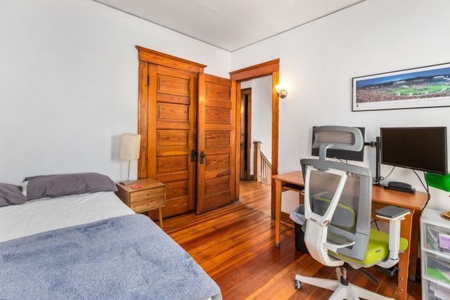 bedroom with wood finished floors