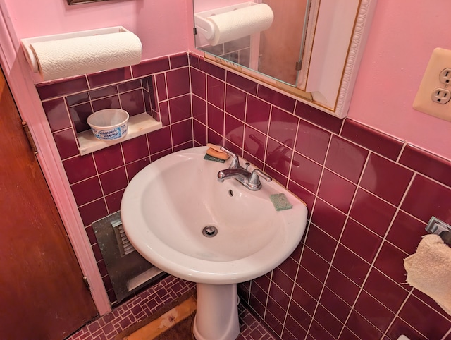 bathroom with tile walls