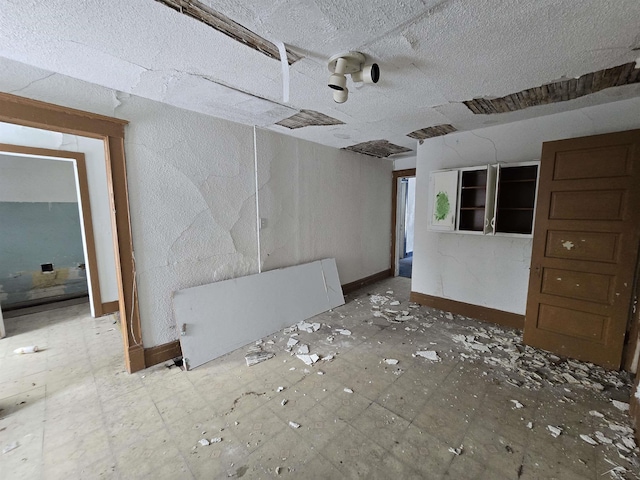 empty room featuring a textured ceiling