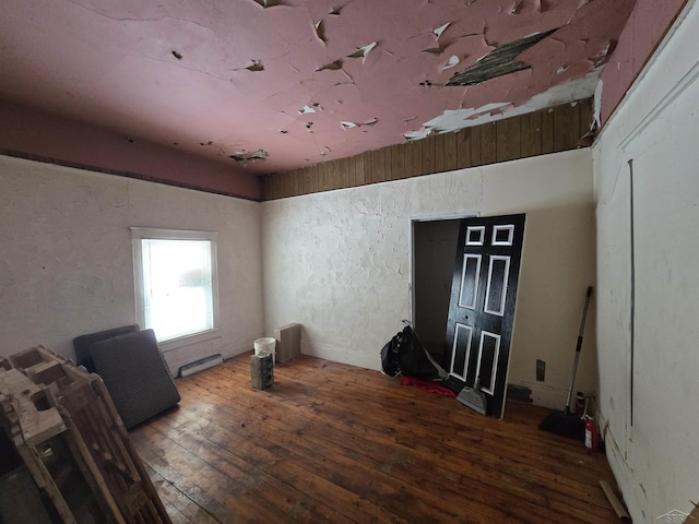 spare room with wood finished floors