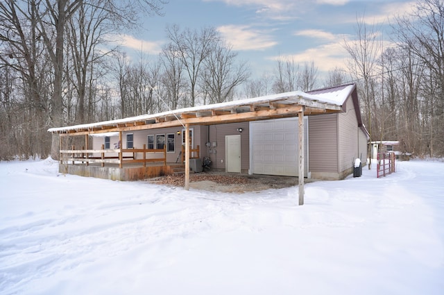 exterior space featuring a garage and covered porch