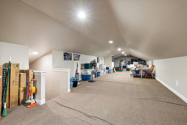 interior space featuring lofted ceiling, baseboards, carpet, and recessed lighting