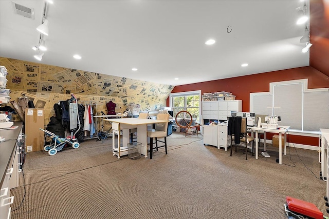 interior space featuring lofted ceiling, carpet flooring, visible vents, and rail lighting