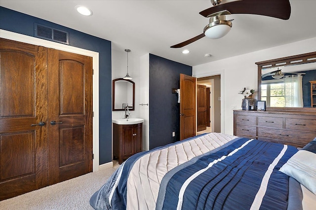 carpeted bedroom featuring a ceiling fan, recessed lighting, and visible vents