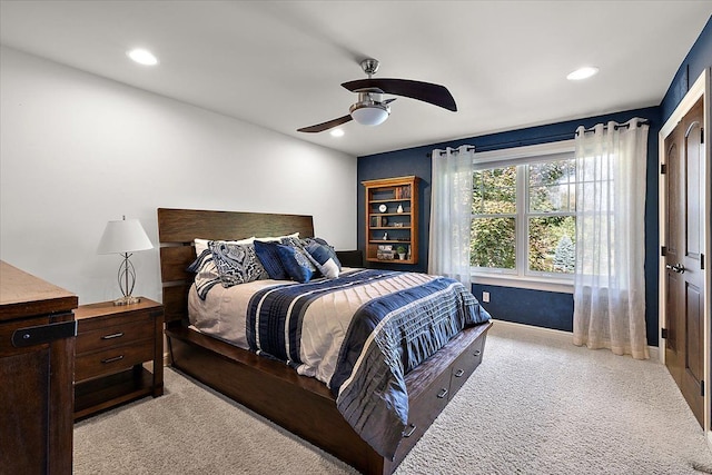 bedroom with recessed lighting, light carpet, ceiling fan, and baseboards