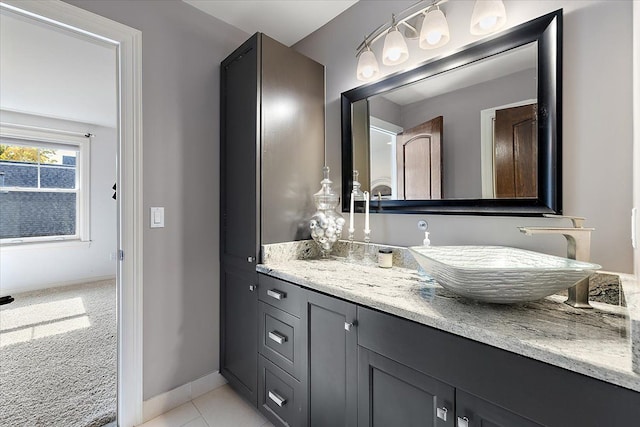 bathroom with vanity and baseboards