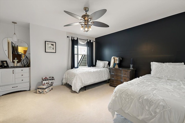 carpeted bedroom featuring a ceiling fan