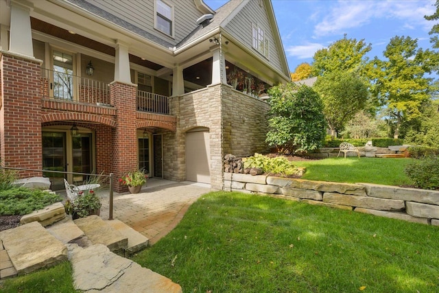 exterior space with a patio area and a yard