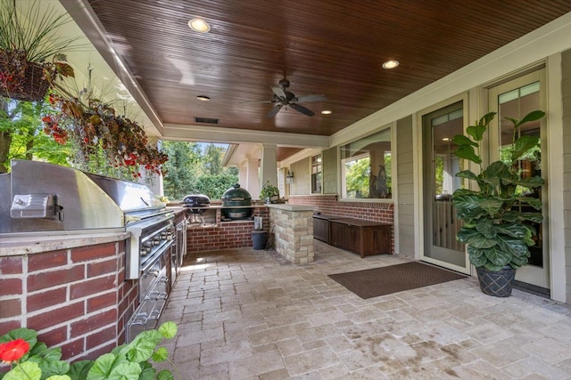 view of patio / terrace featuring area for grilling, a grill, and a ceiling fan