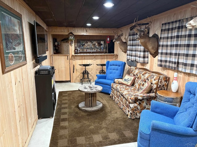 living room with wooden ceiling, wood walls, light carpet, and recessed lighting