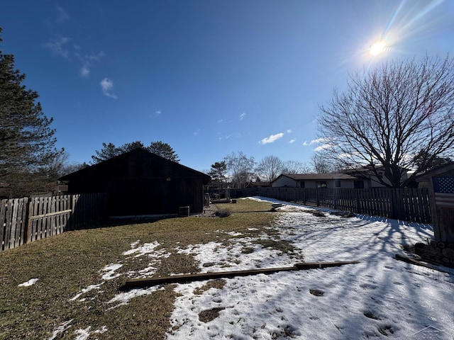 view of yard featuring an outbuilding and a fenced backyard