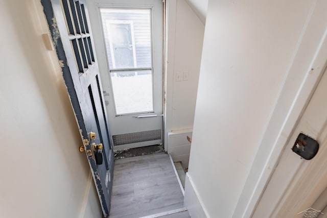 doorway to outside with wood finished floors