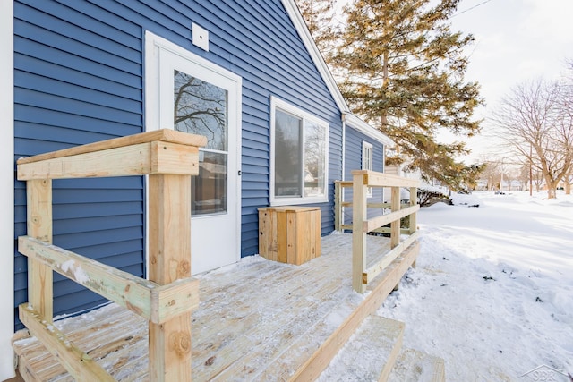 view of snow covered property entrance