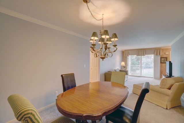 dining area featuring crown molding, light colored carpet, baseboards, and a chandelier