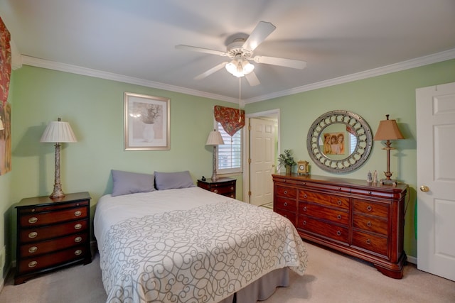 carpeted bedroom with ceiling fan and ornamental molding