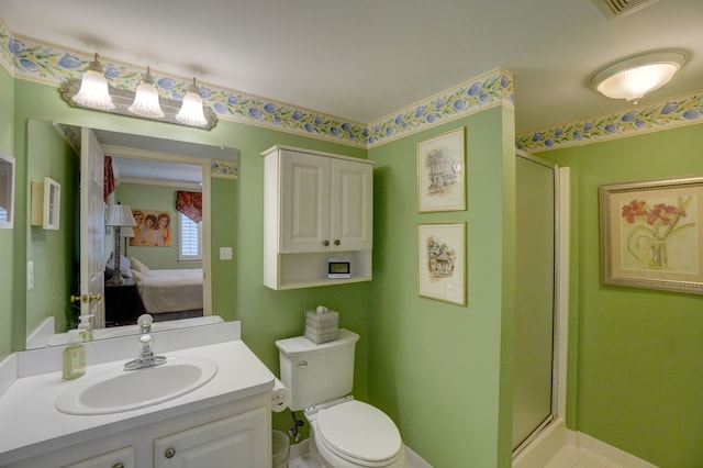 full bathroom with a shower stall, vanity, ensuite bathroom, and toilet