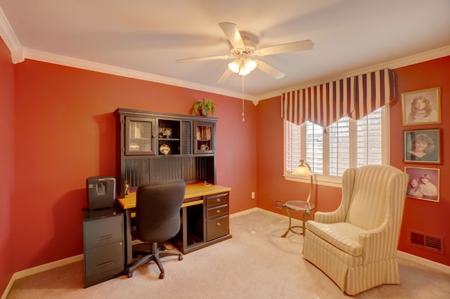 office area with visible vents, light colored carpet, ornamental molding, and a ceiling fan