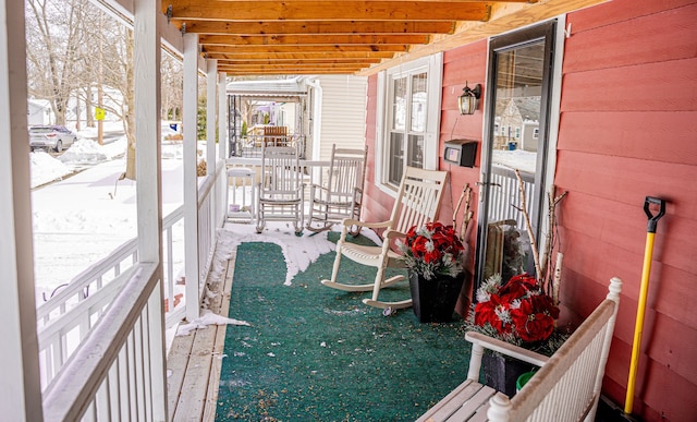 sunroom featuring beam ceiling