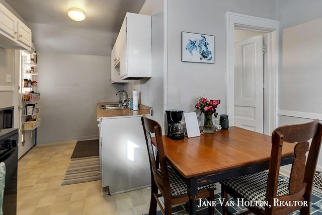 dining space featuring light floors