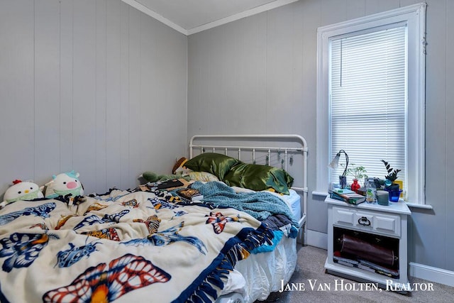 carpeted bedroom with crown molding