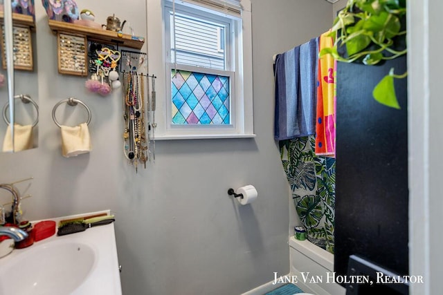 bathroom featuring a sink and toilet