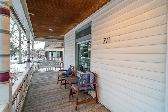 wooden deck featuring covered porch