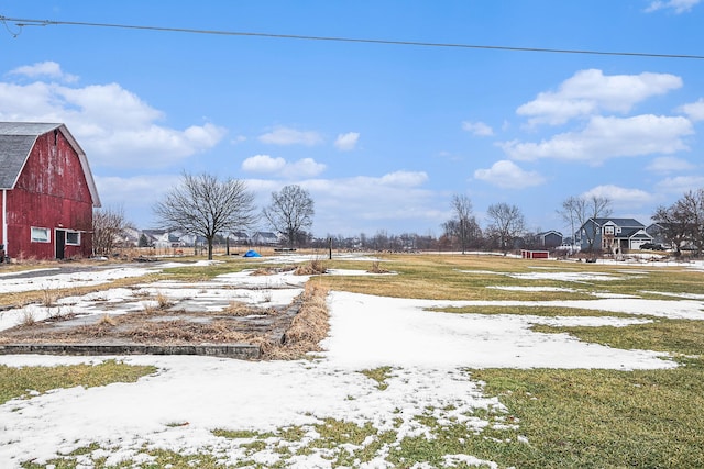 3342 Oak Grove Rd, Howell, MI 48855 - yard covered in snow featuring a barn and an outdoor structure