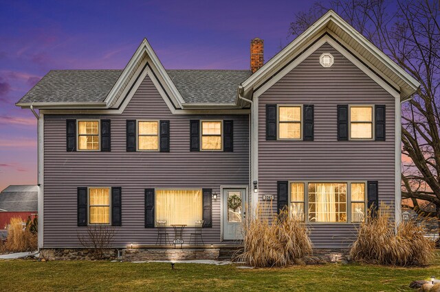 3342 Oak Grove Rd, Howell, MI 48855 - view of front of home featuring a shingled roof, a chimney, and a front yard
