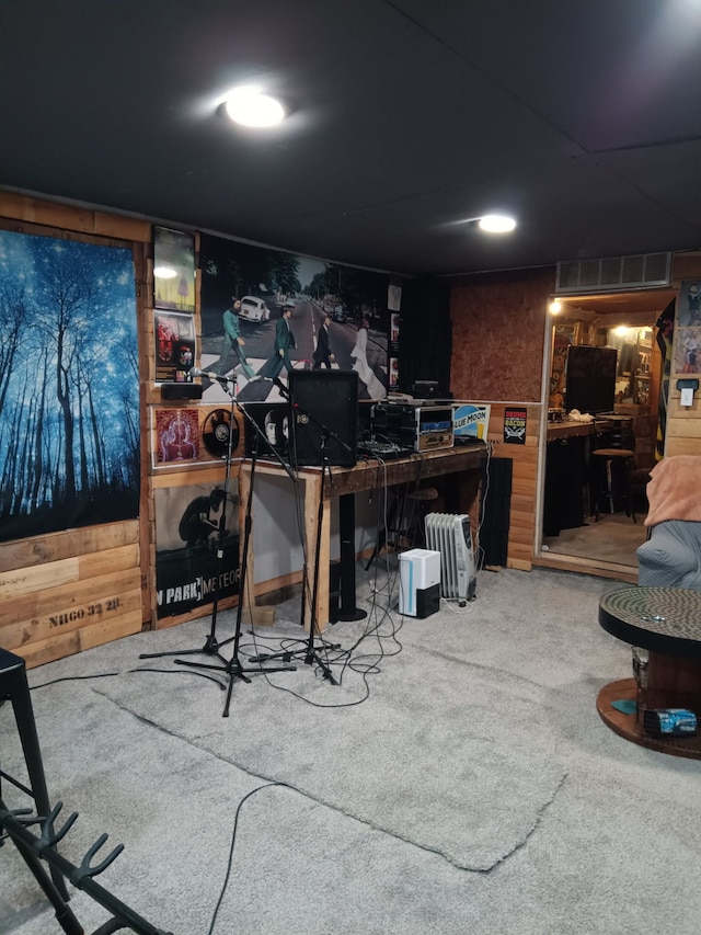 3342 Oak Grove Rd, Howell, MI 48855 - interior space with carpet floors, wood walls, and visible vents