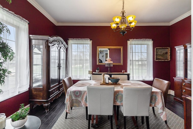 3342 Oak Grove Rd, Howell, MI 48855 - dining space with crown molding, a notable chandelier, dark wood-style floors, and a wealth of natural light