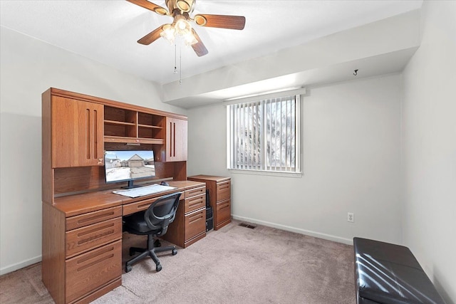 office with light colored carpet, ceiling fan, visible vents, and baseboards