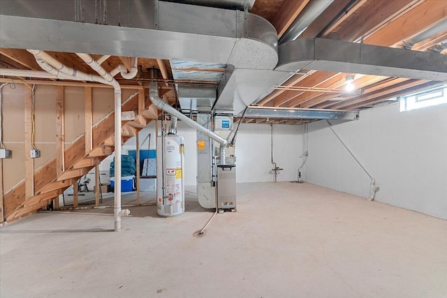 basement with heating unit and water heater