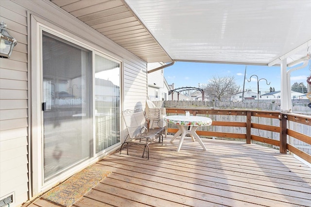 wooden deck featuring outdoor dining area