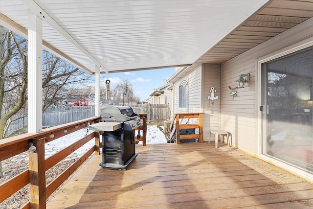 wooden deck with grilling area and fence